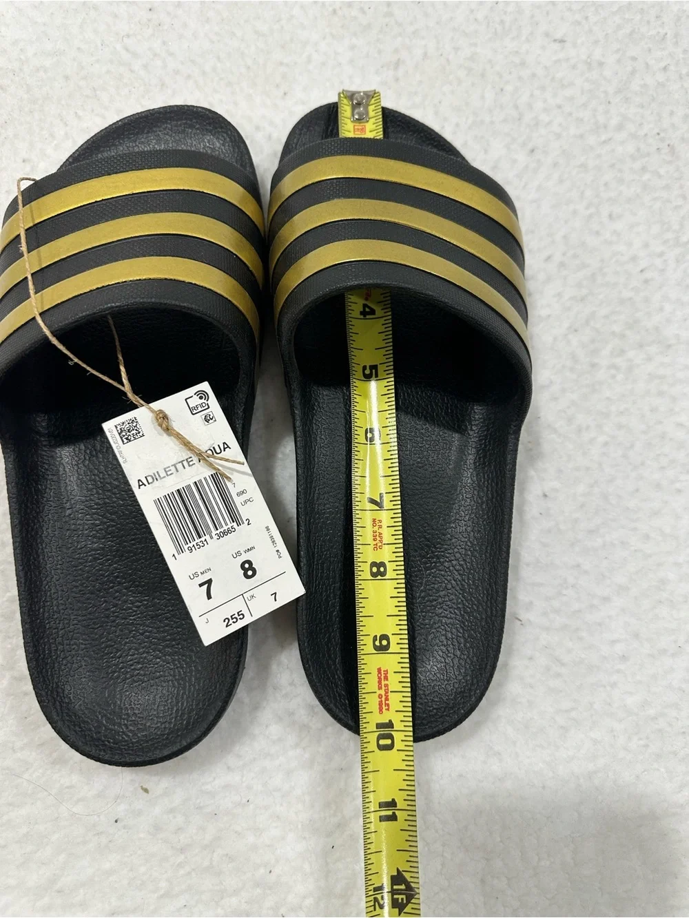 Adidas Black Slide Sandals with Gold Stripes